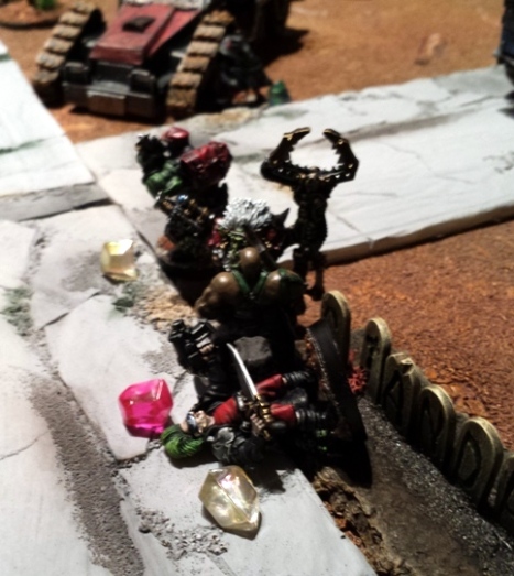 Although KJB still hasnt found what he is looking for, Rosa takes him down.  Nonetheless, Kronkie takes point as Zodgrods charms prove more persuasive. Zodgrod gains the Plot Point and  his scanner picks up a damaged drone from the ship crash nearby,